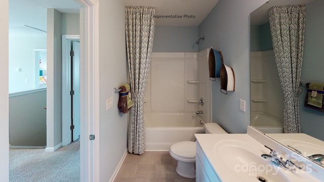 full bath featuring shower / bath combo, toilet, vanity, and baseboards