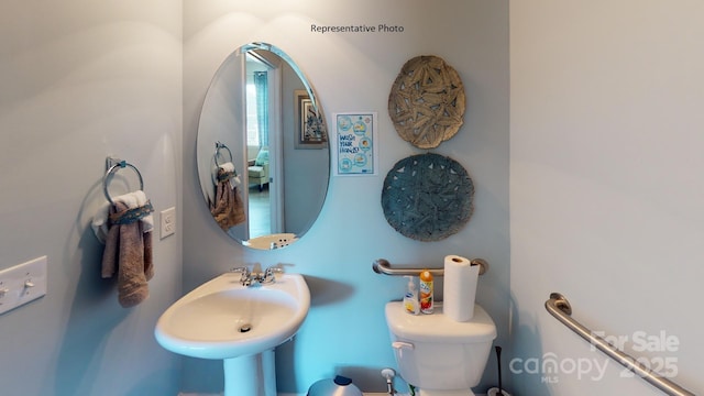 bathroom featuring a sink and toilet