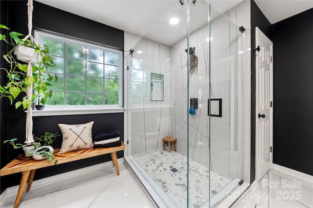 bathroom with a marble finish shower