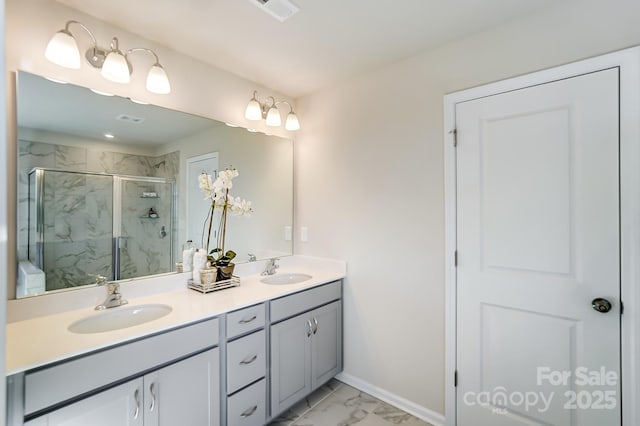 2636 Tillman St, Monroe, NC 28112 - bathroom featuring marble finish flooring, a marble finish shower, double vanity, and baseboards