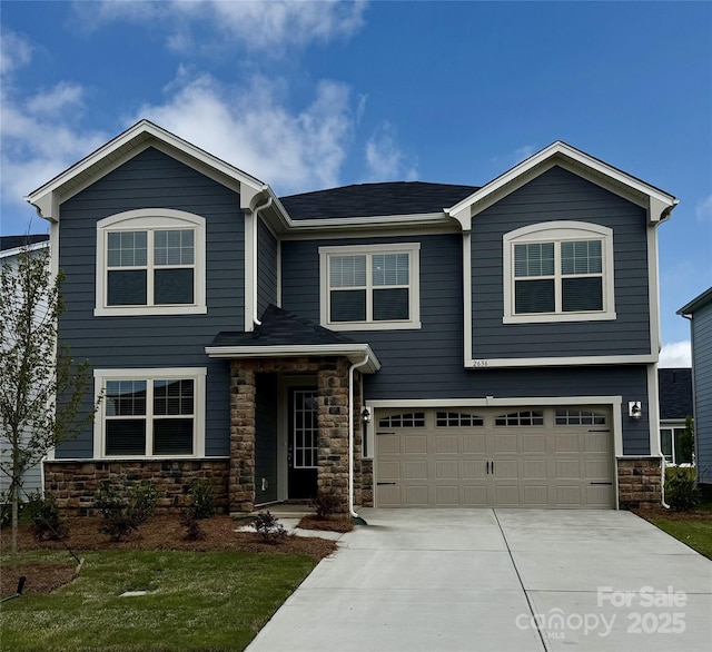 2636 Tillman St, Monroe, NC 28112 - view of front of home with concrete driveway, stone siding, and an attached garage