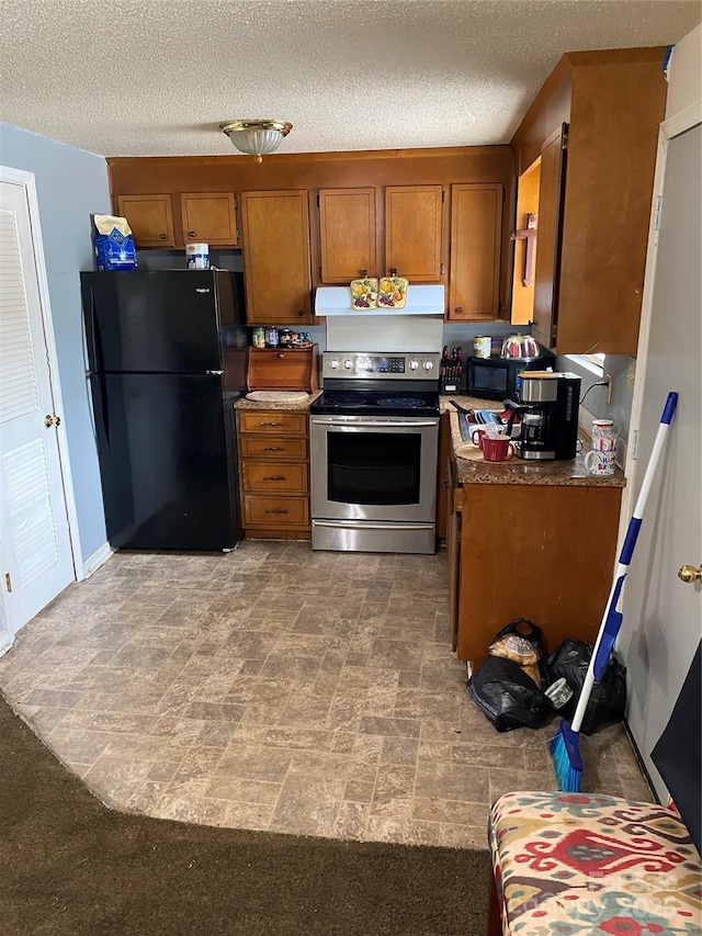 5309 Lewis Rd, Gastonia, NC 28052 - kitchen with black appliances, brown cabinets, under cabinet range hood, and a textured ceiling