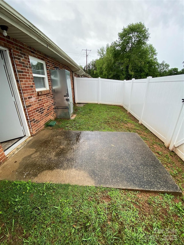 5309 Lewis Rd, Gastonia, NC 28052 - fenced backyard featuring a patio area