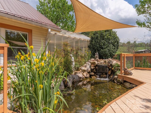 10 Gardening Frog Trl, Waynesville, NC 28785 - wooden terrace featuring a greenhouse and a small pond