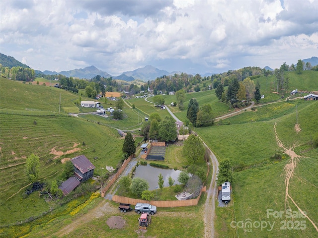 10 Gardening Frog Trl, Waynesville, NC 28785 - aerial overview of property's location featuring rural landscape, a mountain backdrop, and agricultural land
