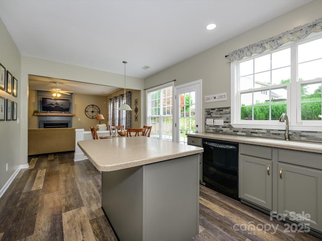 3224 Dunbar Ln, Fort Mill, SC 29707 - kitchen featuring a sink, black dishwasher, gray cabinets, a center island, and light countertops