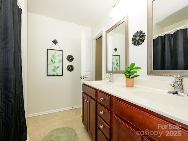 3224 Dunbar Ln, Fort Mill, SC 29707 - full bath featuring double vanity, baseboards, and tile patterned floors