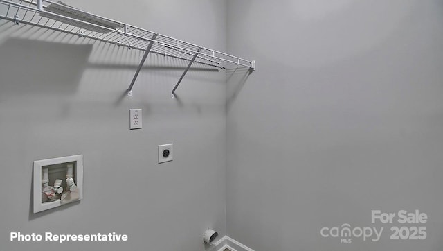 laundry area with electric dryer hookup, baseboards, and washer hookup
