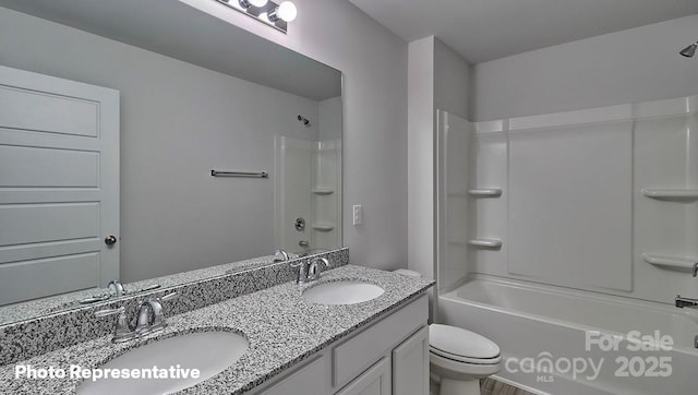 full bath with toilet, double vanity, and shower / bath combination