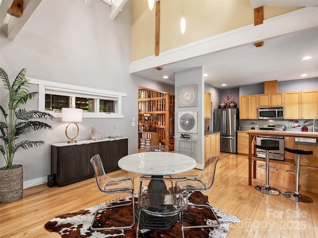 11 Kenilworth Rd, Asheville, NC 28803 - dining room featuring high vaulted ceiling, light wood-style flooring, beam ceiling, and recessed lighting