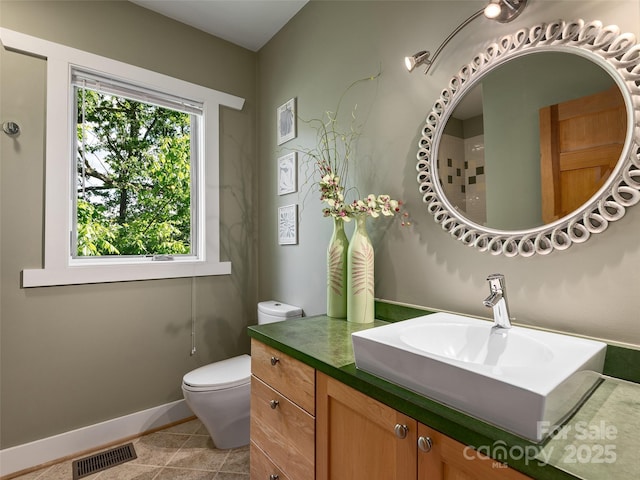 11 Kenilworth Rd, Asheville, NC 28803 - bathroom with toilet, tile patterned flooring, vanity, and baseboards