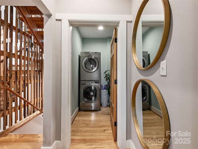 11 Kenilworth Rd, Asheville, NC 28803 - clothes washing area with stacked washer / drying machine, light wood-style flooring, and baseboards