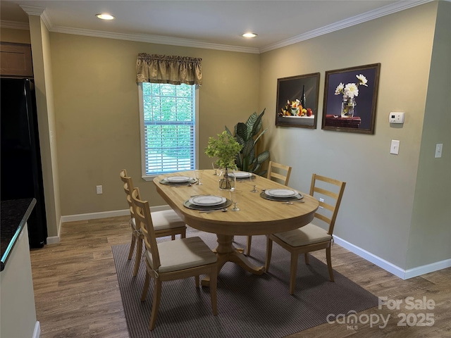 3499 Fairview Rd, Nebo, NC 28761 - dining space featuring light wood finished floors, recessed lighting, baseboards, and crown molding