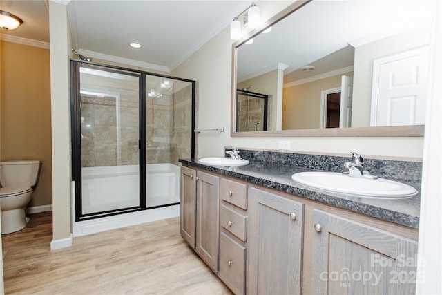3499 Fairview Rd, Nebo, NC 28761 - bathroom with toilet, crown molding, a stall shower, double vanity, and wood finished floors