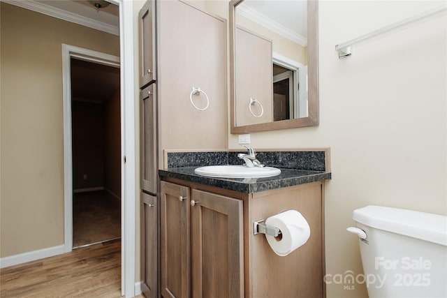 3499 Fairview Rd, Nebo, NC 28761 - half bath with ornamental molding, wood finished floors, toilet, vanity, and baseboards