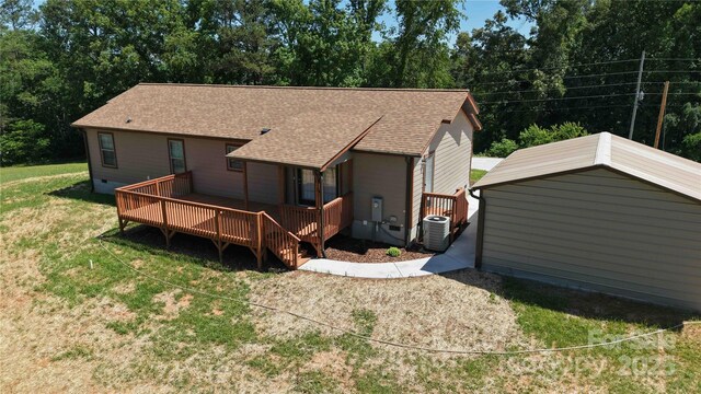 3499 Fairview Rd, Nebo, NC 28761 - rear view of property with cooling unit, a yard, a wooden deck, and a shingled roof
