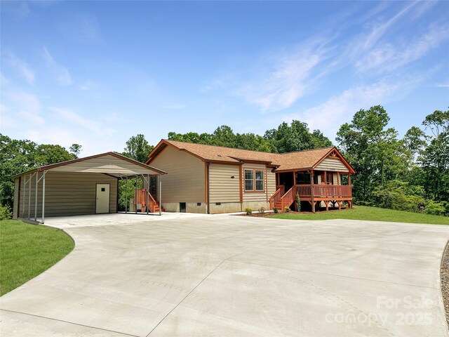 3499 Fairview Rd, Nebo, NC 28761 - view of front of home with concrete driveway, crawl space, a carport, and a front lawn