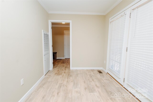 3499 Fairview Rd, Nebo, NC 28761 - unfurnished bedroom with crown molding, light wood-style flooring, baseboards, and access to outside