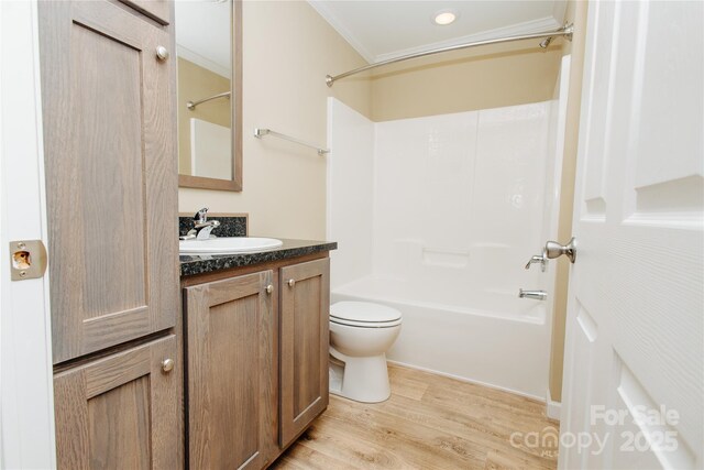 3499 Fairview Rd, Nebo, NC 28761 - full bath featuring vanity, wood finished floors, bathing tub / shower combination, toilet, and ornamental molding