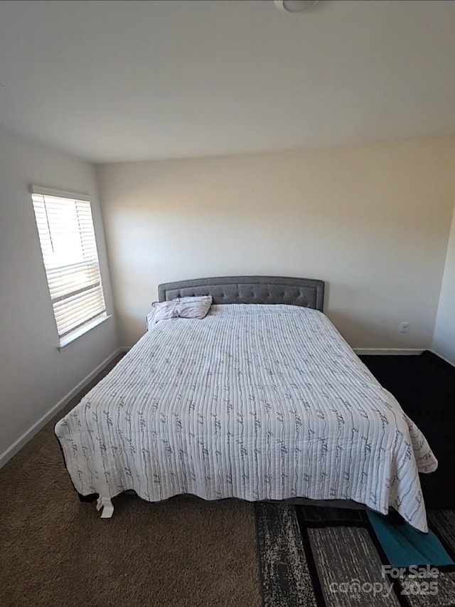 carpeted bedroom with baseboards
