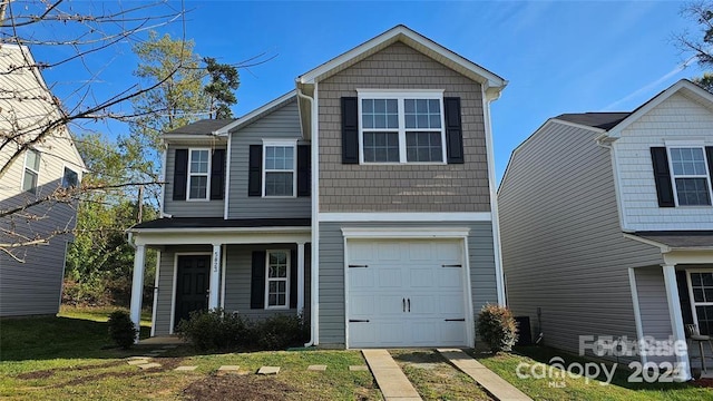 5823 Natick Dr, Charlotte, NC 28214 - traditional-style home featuring an attached garage and covered porch