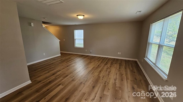 5823 Natick Dr, Charlotte, NC 28214 - empty room with dark wood-style floors and baseboards