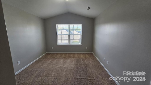 5823 Natick Dr, Charlotte, NC 28214 - carpeted spare room featuring lofted ceiling and baseboards