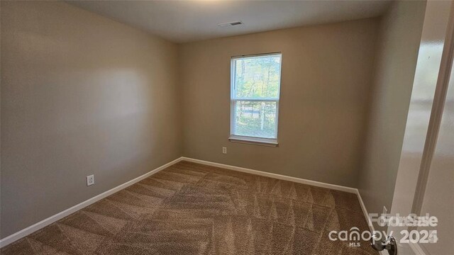 5823 Natick Dr, Charlotte, NC 28214 - unfurnished room featuring carpet and baseboards