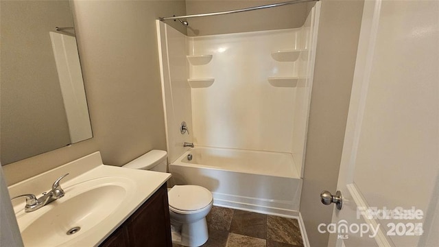 5823 Natick Dr, Charlotte, NC 28214 - full bath with toilet, vanity, shower / bathtub combination, and stone finish flooring