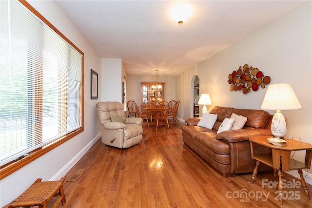 109 Wilkie Way, Fletcher, NC 28732 - living room with light wood-type flooring, healthy amount of natural light, a chandelier, and baseboards