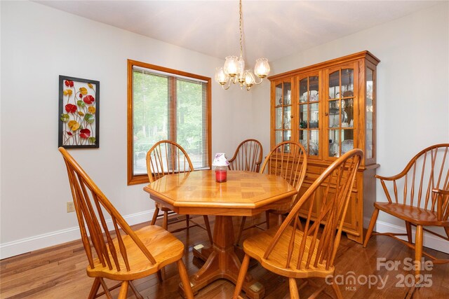 109 Wilkie Way, Fletcher, NC 28732 - dining room with a chandelier, baseboards, and light wood-type flooring