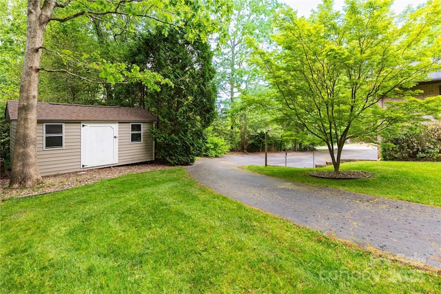 109 Wilkie Way, Fletcher, NC 28732 - view of green lawn featuring an outdoor structure and a storage shed