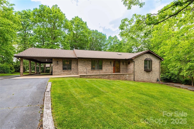 109 Wilkie Way, Fletcher, NC 28732 - ranch-style home featuring driveway, a front lawn, brick siding, and a carport