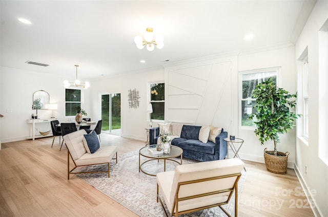 4547 Kings Ct, Hickory, NC 28602 - living room with a chandelier, healthy amount of natural light, light wood-style flooring, crown molding, and recessed lighting