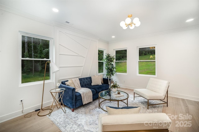 4547 Kings Ct, Hickory, NC 28602 - living area with light wood-style flooring, a chandelier, ornamental molding, plenty of natural light, and recessed lighting