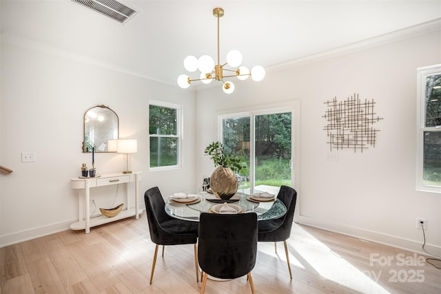 4547 Kings Ct, Hickory, NC 28602 - dining space featuring a chandelier and light wood-style flooring