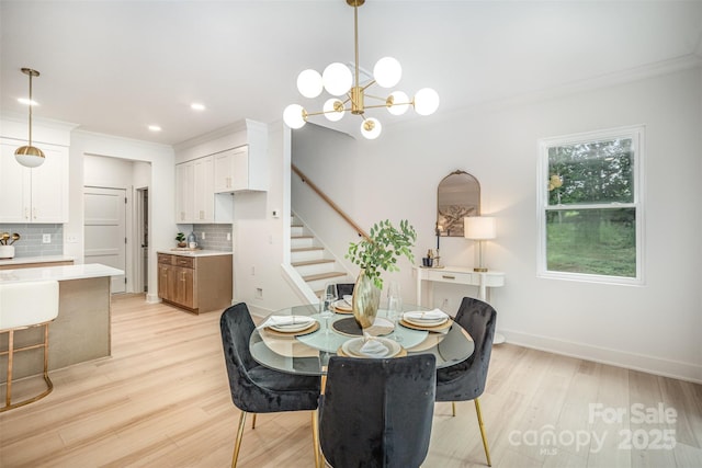 4547 Kings Ct, Hickory, NC 28602 - dining space featuring stairs, light wood-style floors, crown molding, recessed lighting, and a chandelier