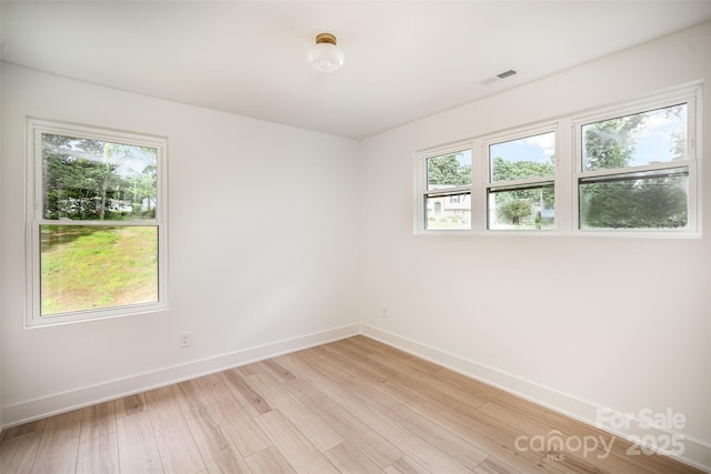 4547 Kings Ct, Hickory, NC 28602 - empty room with plenty of natural light and light wood finished floors