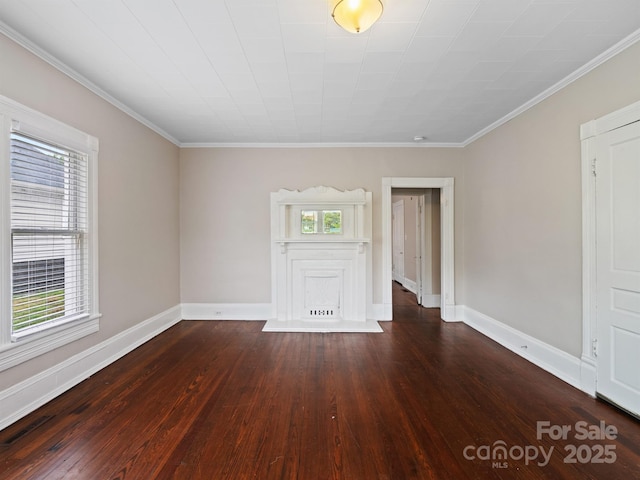 unfurnished room featuring hardwood / wood-style flooring, baseboards, and crown molding
