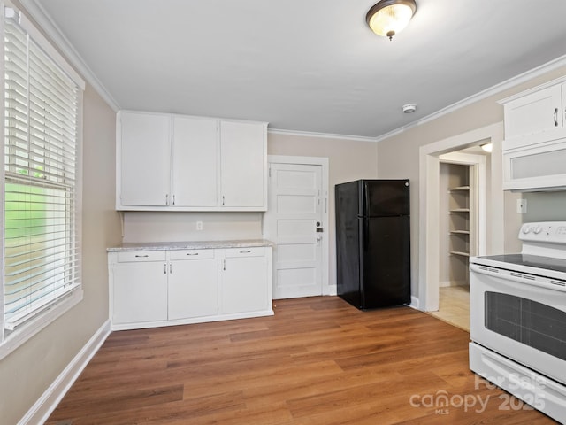 kitchen featuring white appliances, white cabinets, light countertops, crown molding, and light wood finished floors