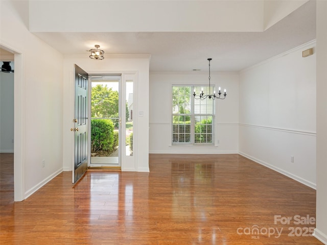 14 Stonehollow Rd, Fletcher, NC 28732 - foyer with a chandelier, light wood-style flooring, crown molding, and baseboards