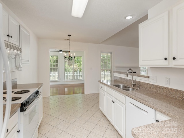 14 Stonehollow Rd, Fletcher, NC 28732 - kitchen with white appliances, a sink, light tile patterned floors, a chandelier, and pendant lighting