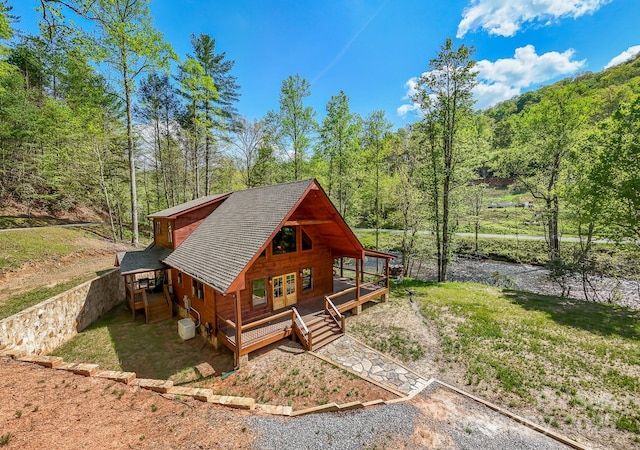91 Riverview Dr, Robbinsville, NC 28771 - view of front of home with a view of trees and roof with shingles