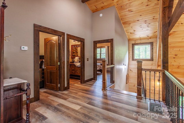 91 Riverview Dr, Robbinsville, NC 28771 - hallway with an upstairs landing, wooden ceiling, wood finished floors, baseboards, and high vaulted ceiling