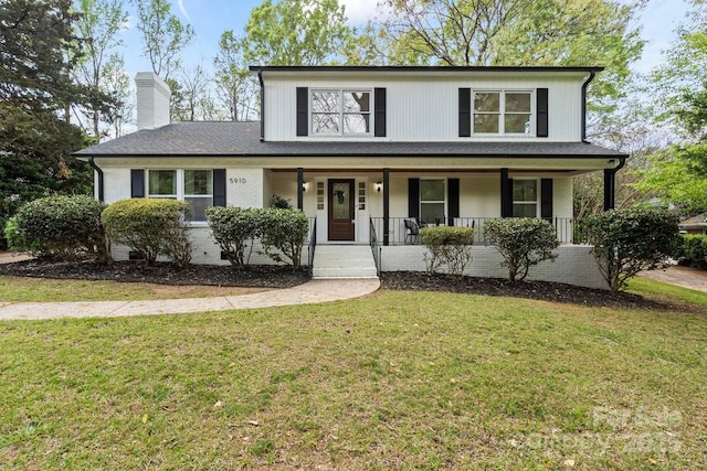 5910 Grosner Pl, Charlotte, NC 28211 - view of front of house featuring a chimney, covered porch, and a front lawn