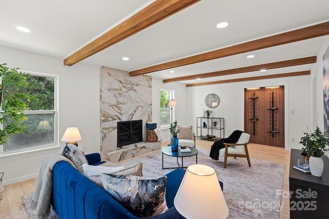 5910 Grosner Pl, Charlotte, NC 28211 - living area featuring wood finished floors, beam ceiling, recessed lighting, and a high end fireplace