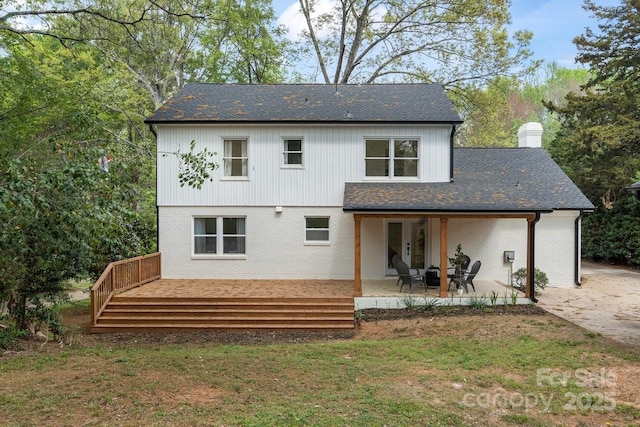 5910 Grosner Pl, Charlotte, NC 28211 - rear view of property with a patio, a wooden deck, a yard, a chimney, and roof with shingles