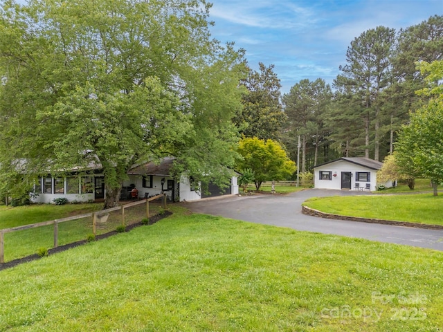 64 Persimmon Hill Dr Unit 4, Columbus, NC 28722 - view of front facade featuring asphalt driveway