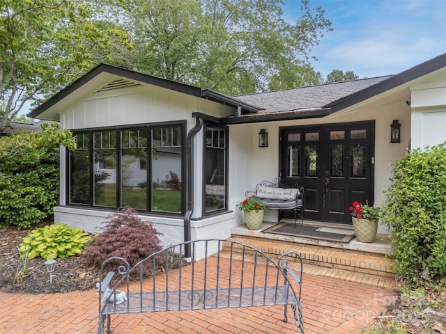 64 Persimmon Hill Dr Unit 4, Columbus, NC 28722 - view of exterior entry with a patio area, brick siding, and a shingled roof