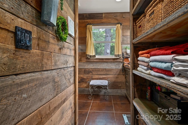 64 Persimmon Hill Dr Unit 4, Columbus, NC 28722 - bathroom featuring wood walls and tile patterned flooring